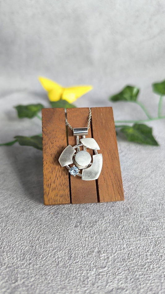 Futuristic spinner Pendant in sterling Silver with Topaz