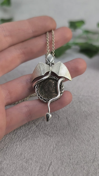 Dragon carrying an authentic roman coin